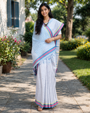 White Saree with Blue Linings and Yellow and Red Border