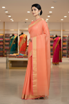 Coral Orange Dobby Saree with Magenta and Golden Zari Border and Lined Butis