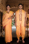 Peach Couple Set with Pink and Golden Zari Border and Butis