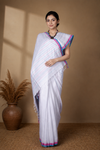 White Saree with Blue and Magenta Linings and Border