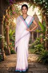 White Saree with Red and Blue Linings and Border