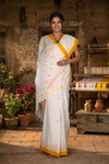 White Semi Hand Spun Hand Woven Saree with Yellow and Orange Border and Butis