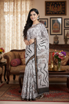 White and Brown Batik Print Saree with Golden Zari Border