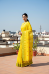 Yellow Saree with Orange, Red, Golden Zari and Green Border and Butis